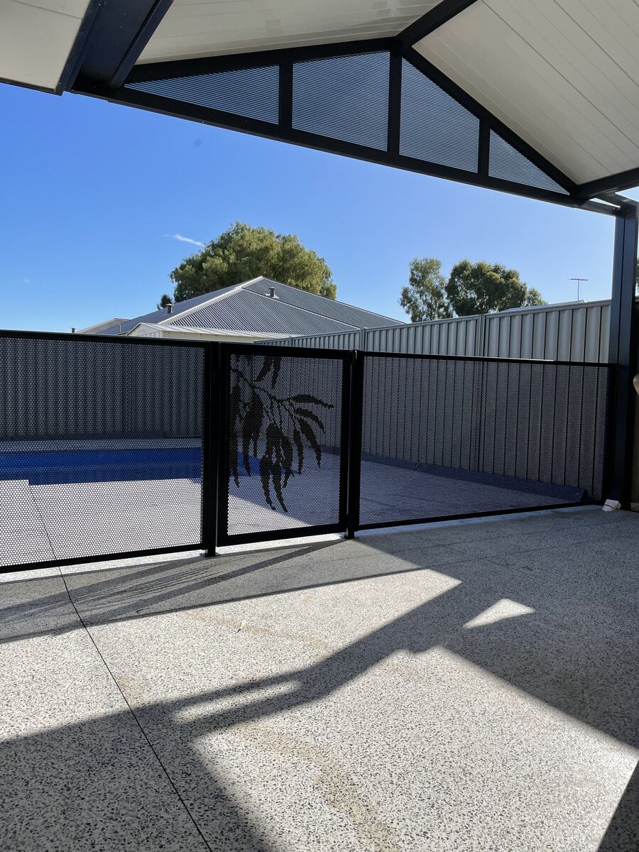 Pure Perf Textured Black fencing along a long pool, Perth