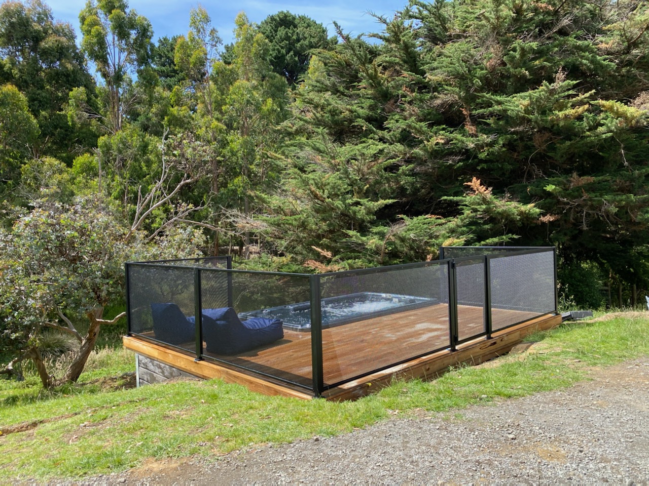 Pure Perf black fencing around a backyard spa and pool, Victoria