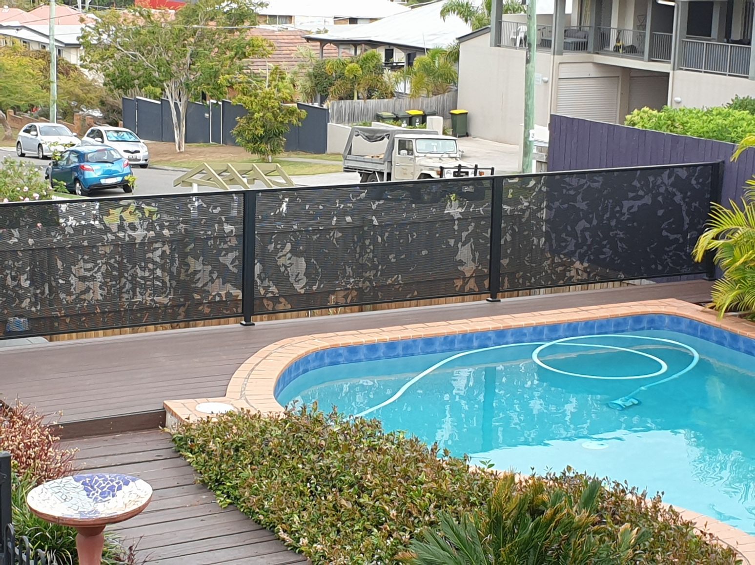 Custom fig tree pattern pool fencing on a deck, Brisbane Queensland