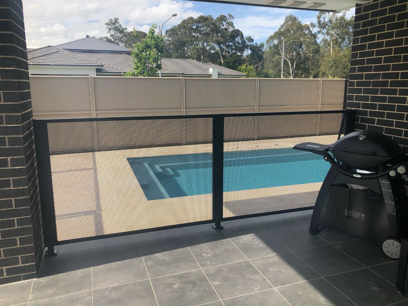 Pure Perf pool fencing beside an outdoor BBQ area, NSW